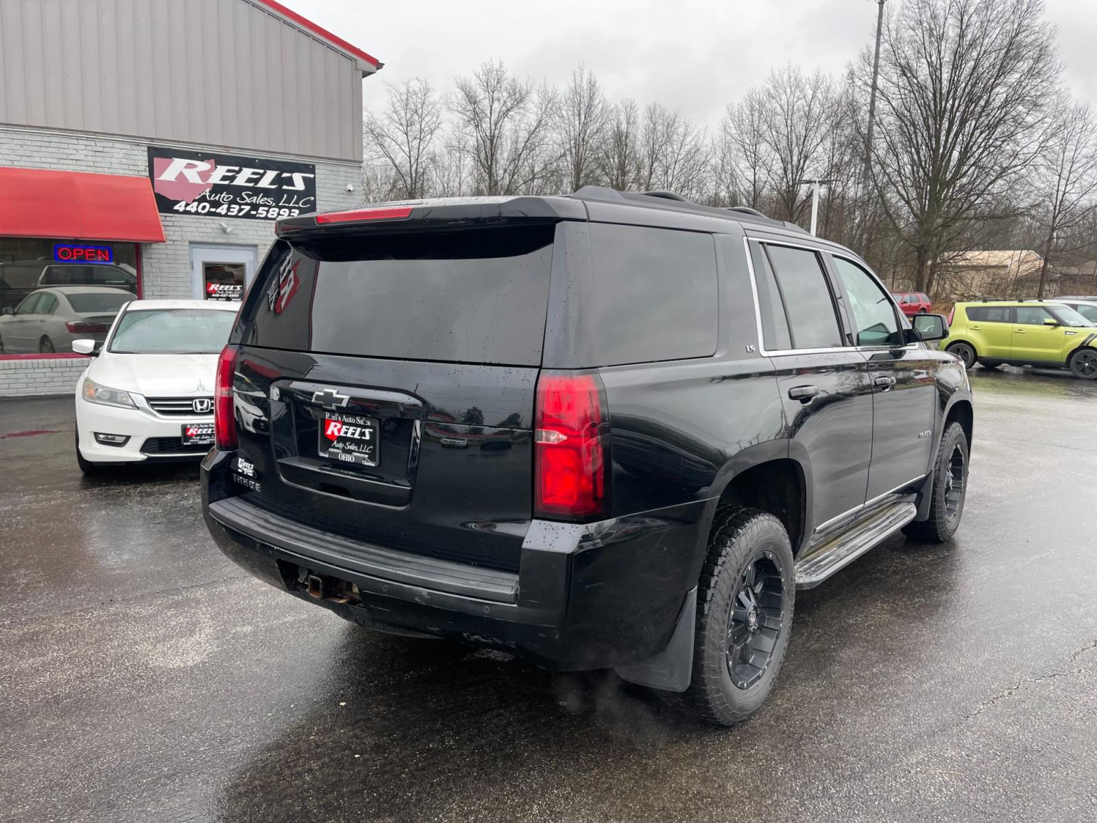 2015 Black /Black Chevrolet Tahoe LS 4WD (1GNSKAEC8FR) with an 5.3L V8 OHV 16V engine, 6-Speed Automatic transmission, located at 547 E. Main St., Orwell, OH, 44076, (440) 437-5893, 41.535435, -80.847855 - This 2015 Chevrolet Tahoe LS 4WD is a versatile and robust full-size SUV that offers a range of comfort and utility features, appealing to families and those needing a capable vehicle for towing and outdoor adventures. Equipped with Tri-Zone Automatic Climate Control, Power Front Seats, and Rain Sen - Photo #9